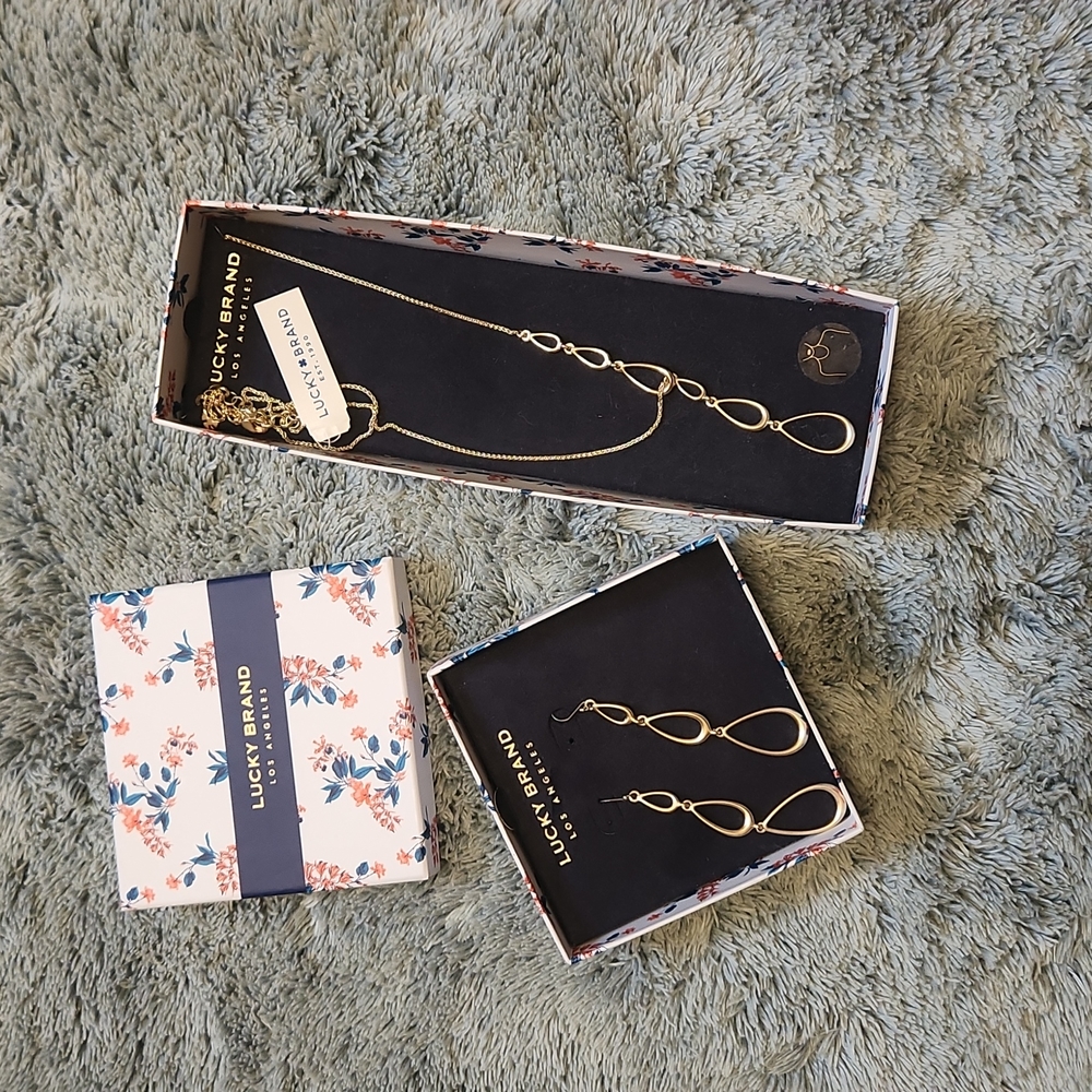 Brand new. Lucky Brand gold tone necklace and earing set. Tear drop design.